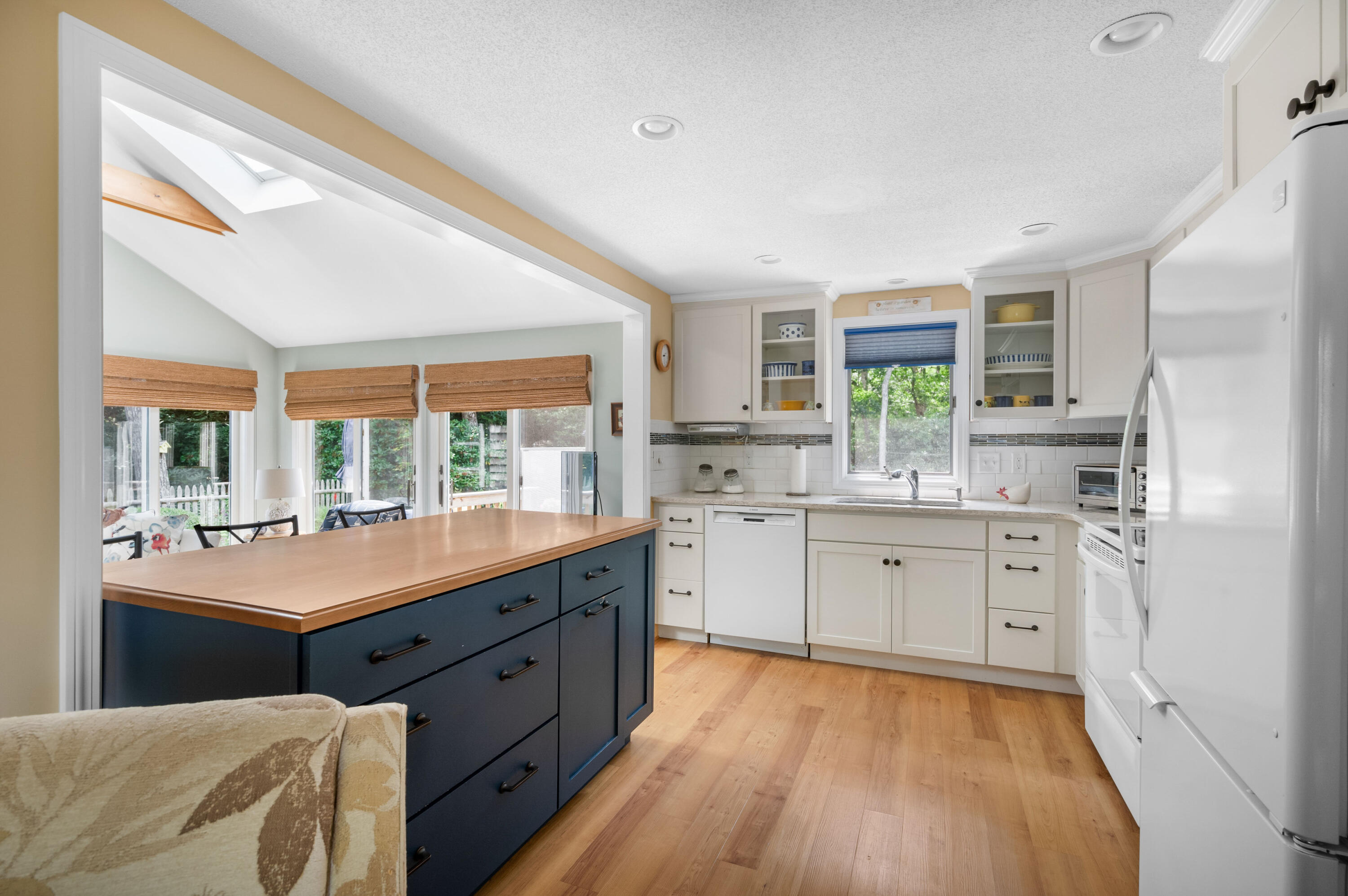 25 Massasoit Trail Eastham, MA 02642 - Photo 9 of 28 a kitchen with a sink stove and cabinets