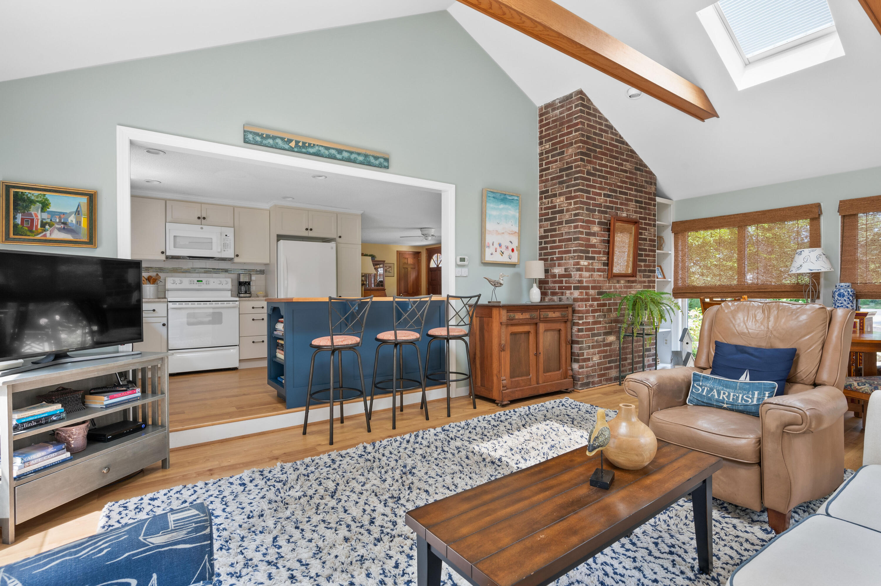 25 Massasoit Trail Eastham, MA 02642 - Photo 10 of 28 a living room with furniture and a flat screen tv