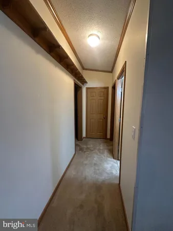 a bed sitting in a room next to a window