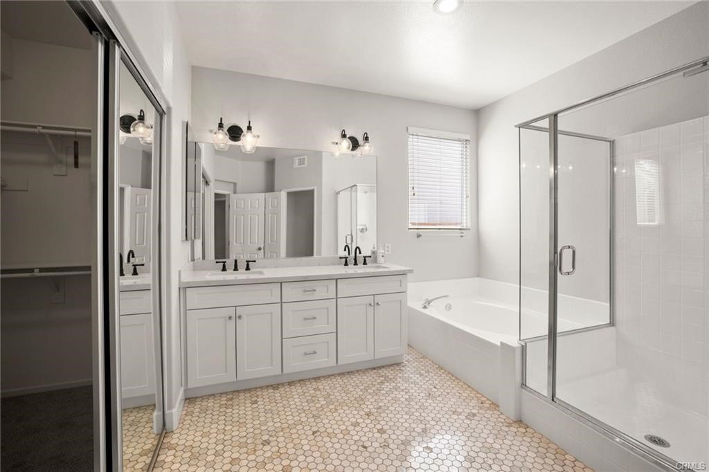 30840 Point Woods Court Temecula, CA 92591 - Photo 20 of 35 a bathroom with a tub sink shower and mirror