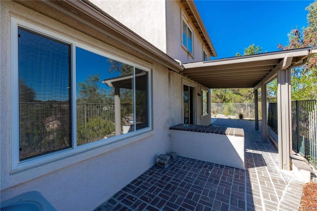 30840 Point Woods Court Temecula, CA 92591 - Photo 28 of 35 a view of a porch with furniture and floor to ceiling window