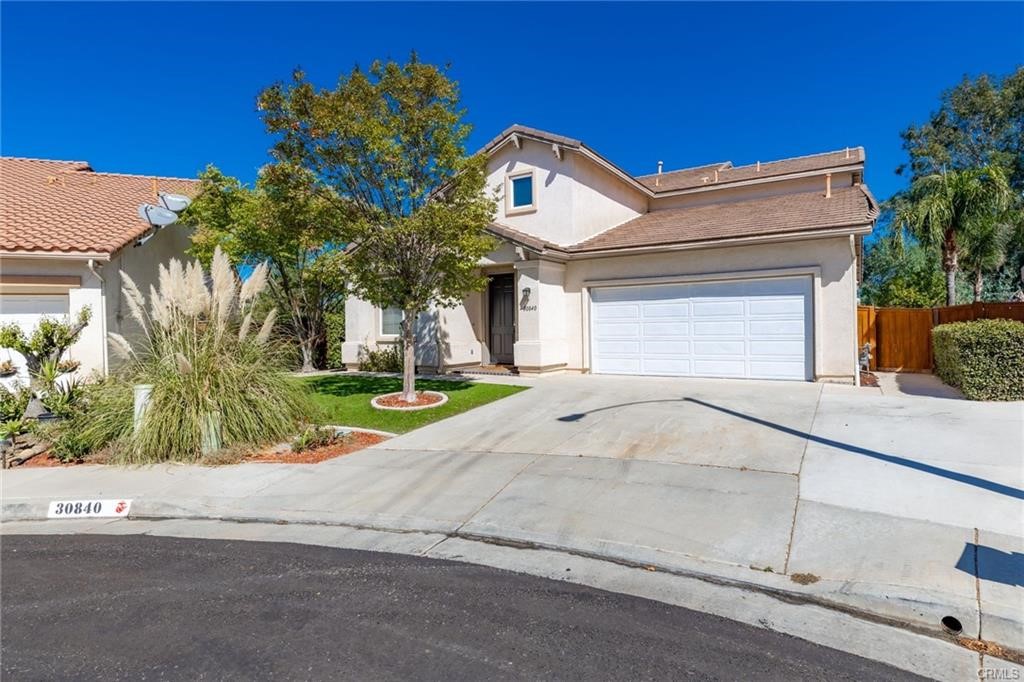 30840 Point Woods Court Temecula, CA 92591 - Photo 35 of 35 a front view of a house with a yard and garage