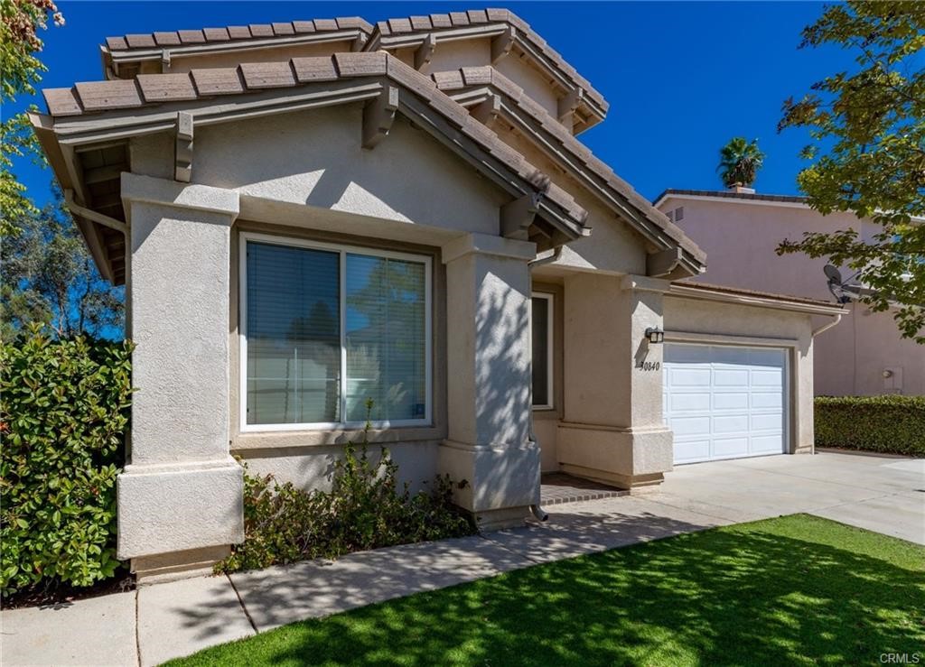 30840 Point Woods Court Temecula, CA 92591 - Photo 4 of 35 a front view of a house with a yard
