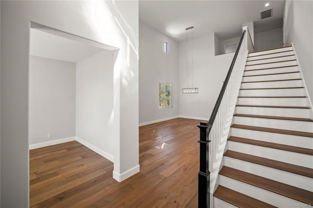30840 Point Woods Court Temecula, CA 92591 - Photo 8 of 35 a view of entryway with wooden floor and stairs