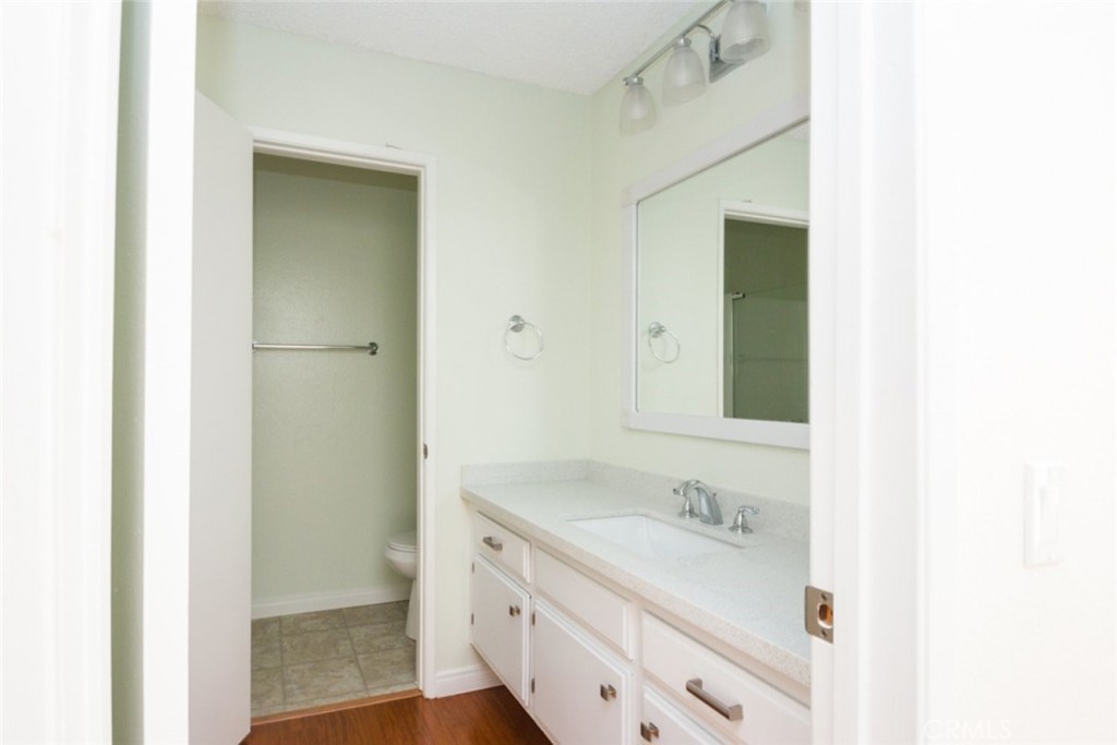 2940 North Verdugo Road, Unit 321 Glendale, CA 91208 - Photo 17 of 38 a bathroom with a granite countertop sink and a mirror