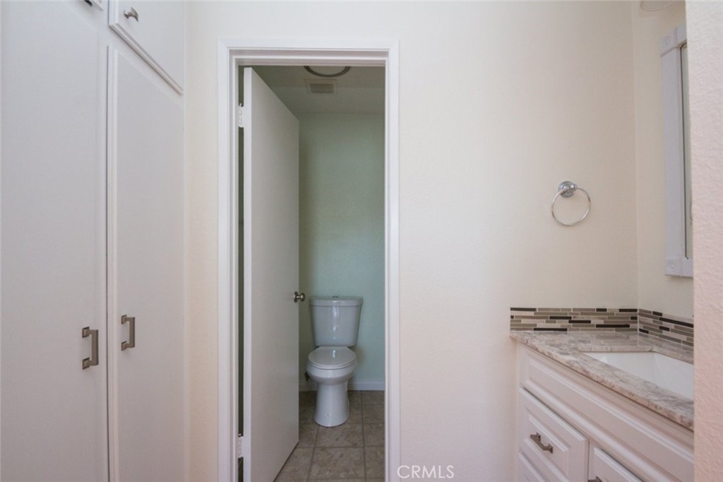2940 North Verdugo Road, Unit 321 Glendale, CA 91208 - Photo 22 of 38 a bathroom with a granite countertop sink