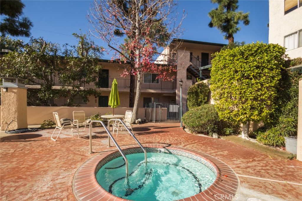 2940 North Verdugo Road, Unit 321 Glendale, CA 91208 - Photo 33 of 38 a view of a swimming pool with a sitting area