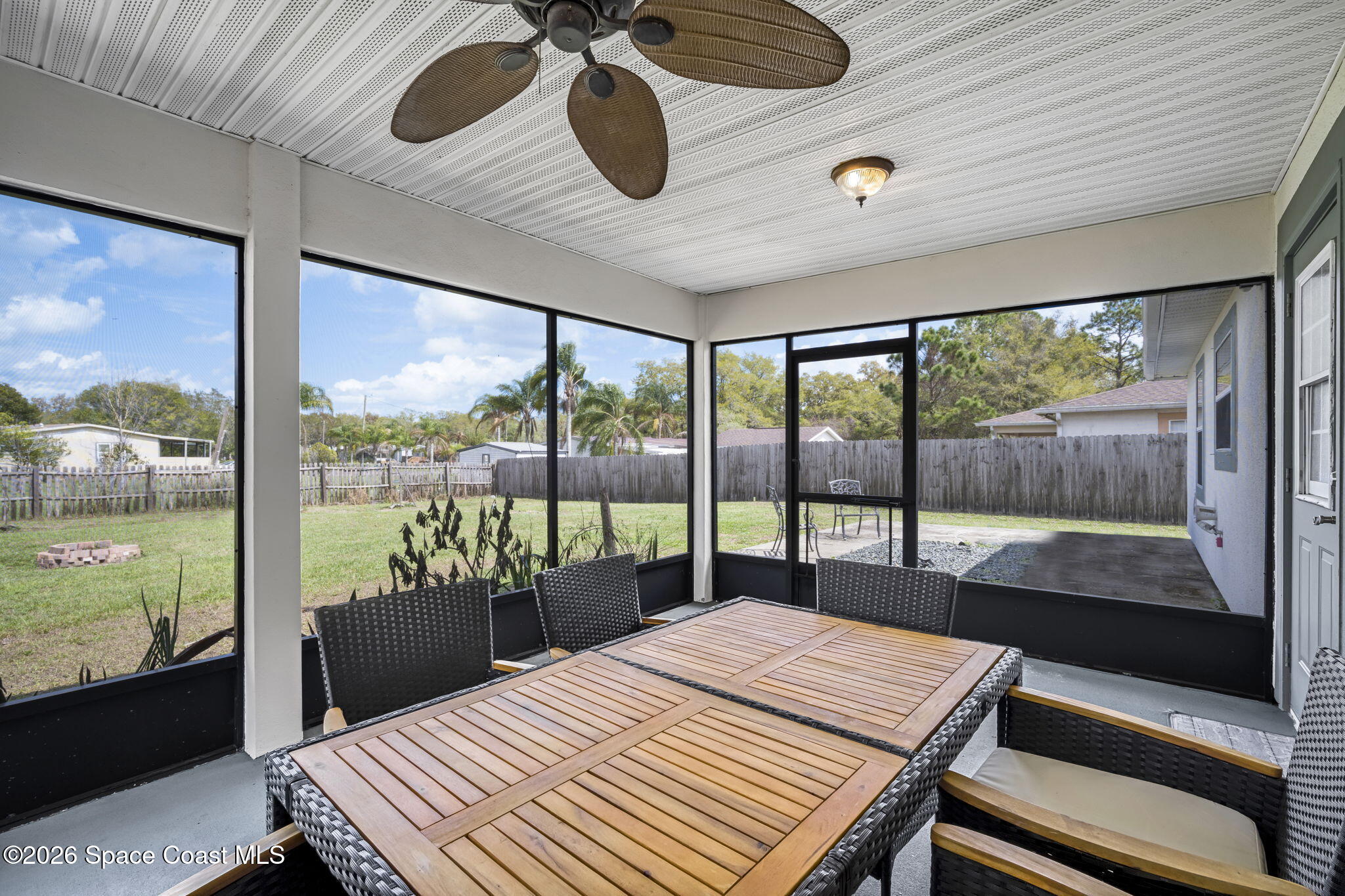 3404 Kilbee Street Mims, FL 32754 - Photo 24 of 30 a bedroom with a bed and large window