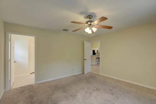 a view of a chandelier fan in a room