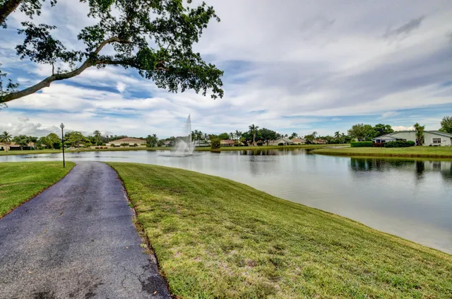 a view of a lake with houses in the back