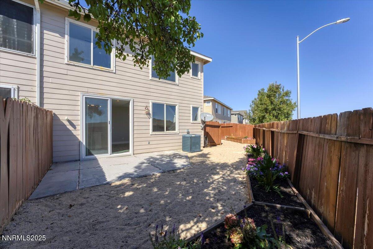 9252 Lone Wolf Circle Reno, NV 89506 - Photo 24 of 26 a front view of a house with a yard