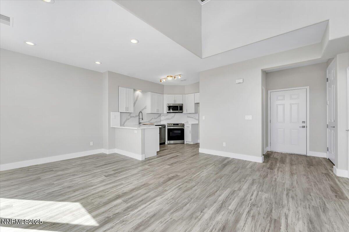 9252 Lone Wolf Circle Reno, NV 89506 - Photo 5 of 26 a view of kitchen view wooden floor and kitchen