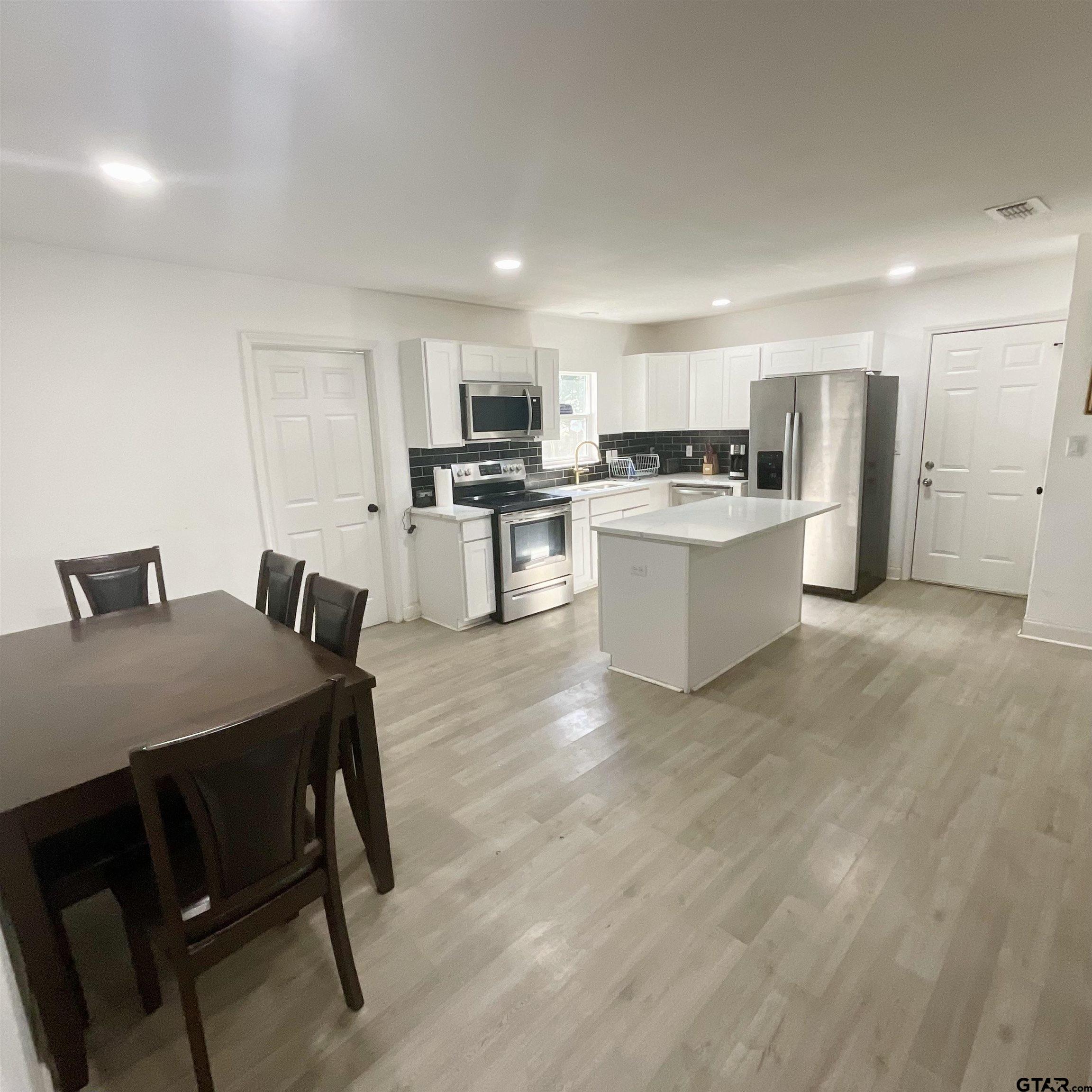 151 Patton Lane Tyler, TX 75704 - Photo 15 of 26 a living room with stainless steel appliances furniture and kitchen view