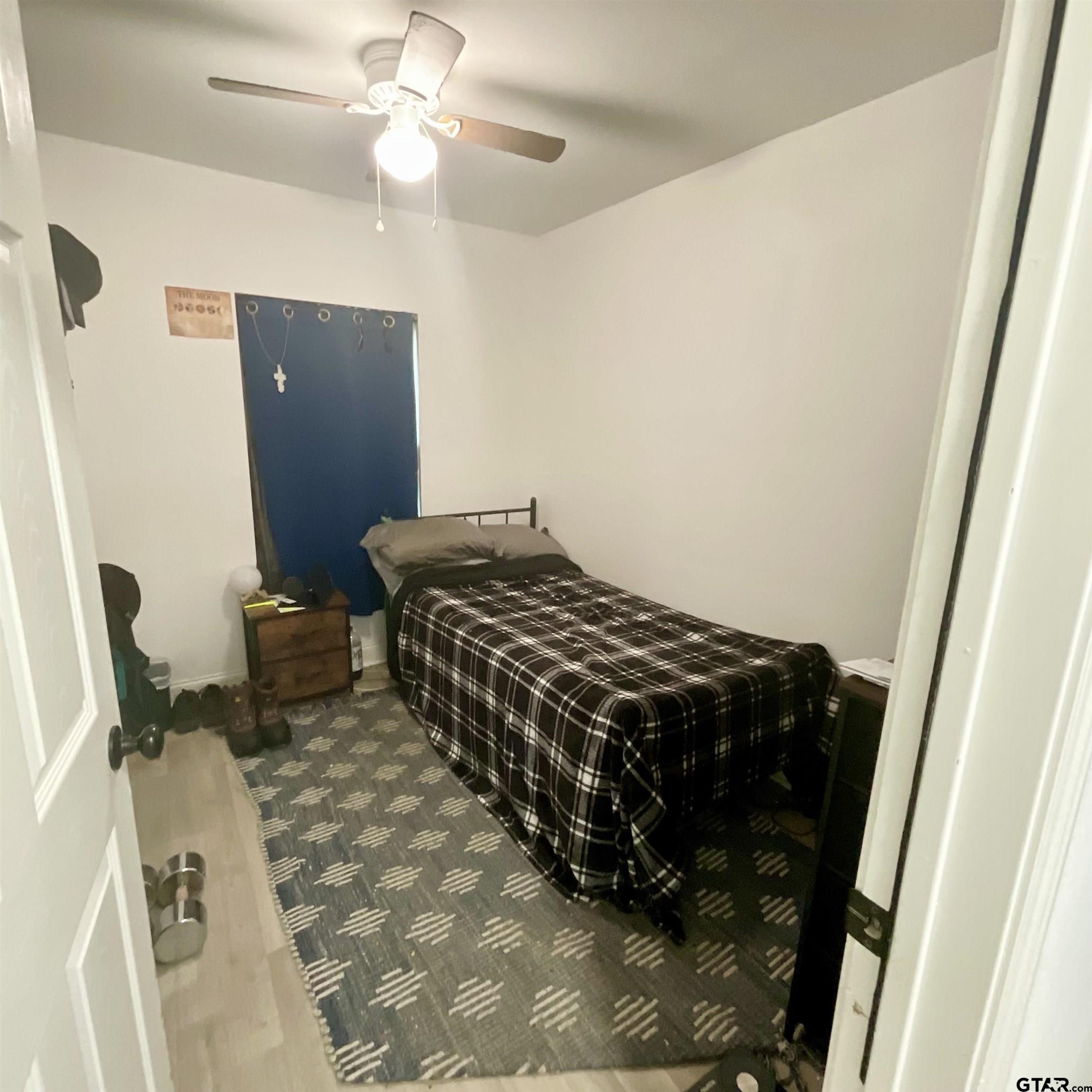 151 Patton Lane Tyler, TX 75704 - Photo 19 of 26 a bedroom with furniture and a mirror