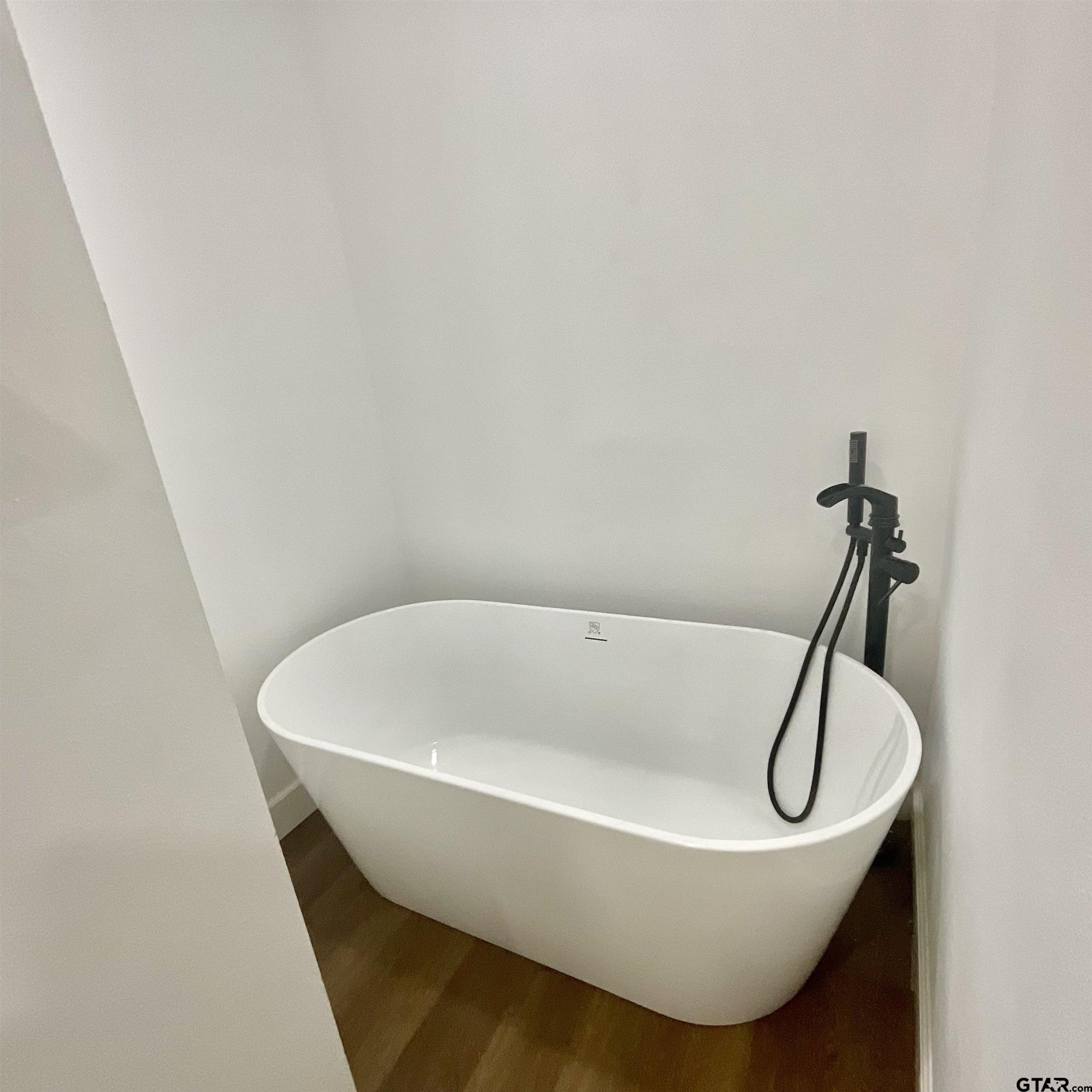 151 Patton Lane Tyler, TX 75704 - Photo 23 of 26 a bath tub sitting in a bathroom