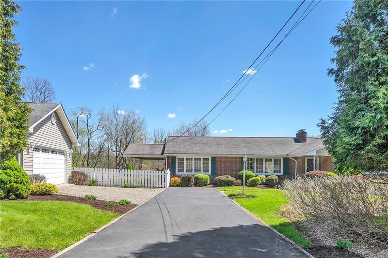 154 Bryson Road Gibsonia, PA 15044 - Photo 1 of 41 a front view of a house with a yard and porch