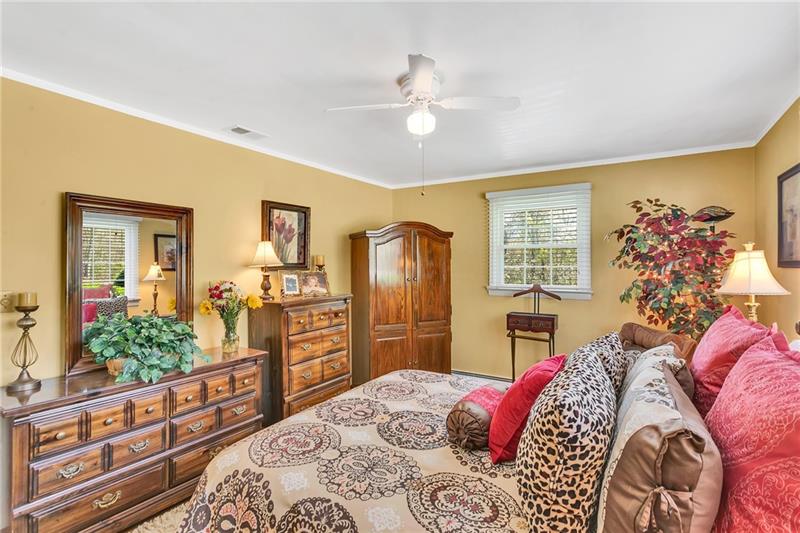 154 Bryson Road Gibsonia, PA 15044 - Photo 20 of 41 a bedroom with a bed and wooden floor