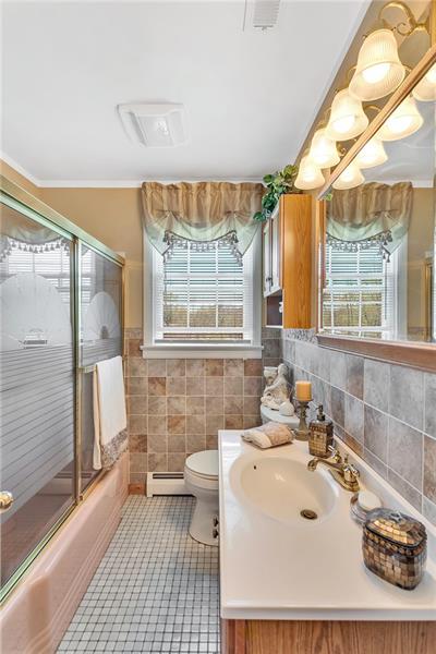 154 Bryson Road Gibsonia, PA 15044 - Photo 21 of 41 a bathroom with a sink a mirror and a shower