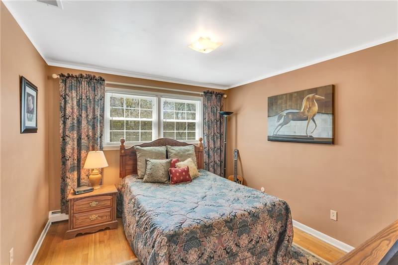 154 Bryson Road Gibsonia, PA 15044 - Photo 24 of 41 a bedroom with a bed and glass door