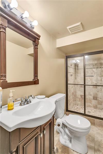 154 Bryson Road Gibsonia, PA 15044 - Photo 25 of 41 a bathroom with a sink a toilet and shower