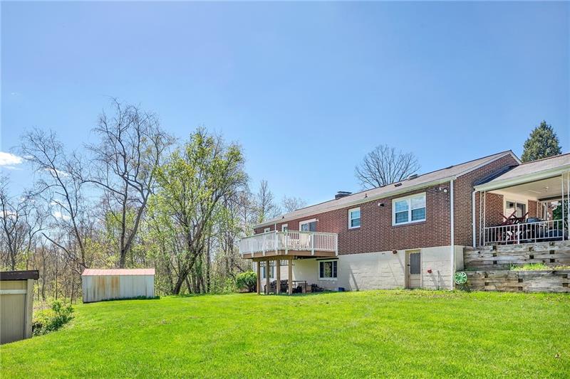 154 Bryson Road Gibsonia, PA 15044 - Photo 38 of 41 a view of a house with a yard and sitting area