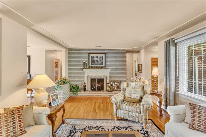 154 Bryson Road Gibsonia, PA 15044 - Photo 8 of 41 a living room with furniture and a fireplace