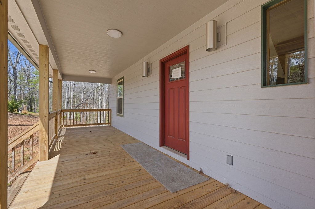 55 Heidis Run Murphy, NC 28906 - Photo 12 of 53 a view of a porch with wooden floor and iron gate