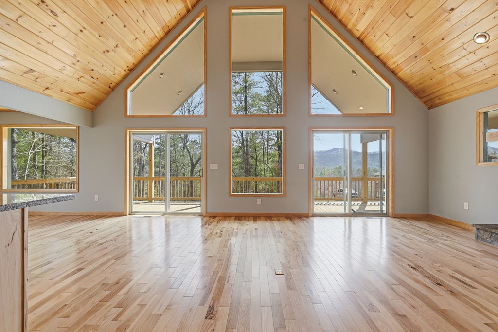 55 Heidis Run Murphy, NC 28906 - Photo 16 of 53 a view of an empty room with wooden floor and a window