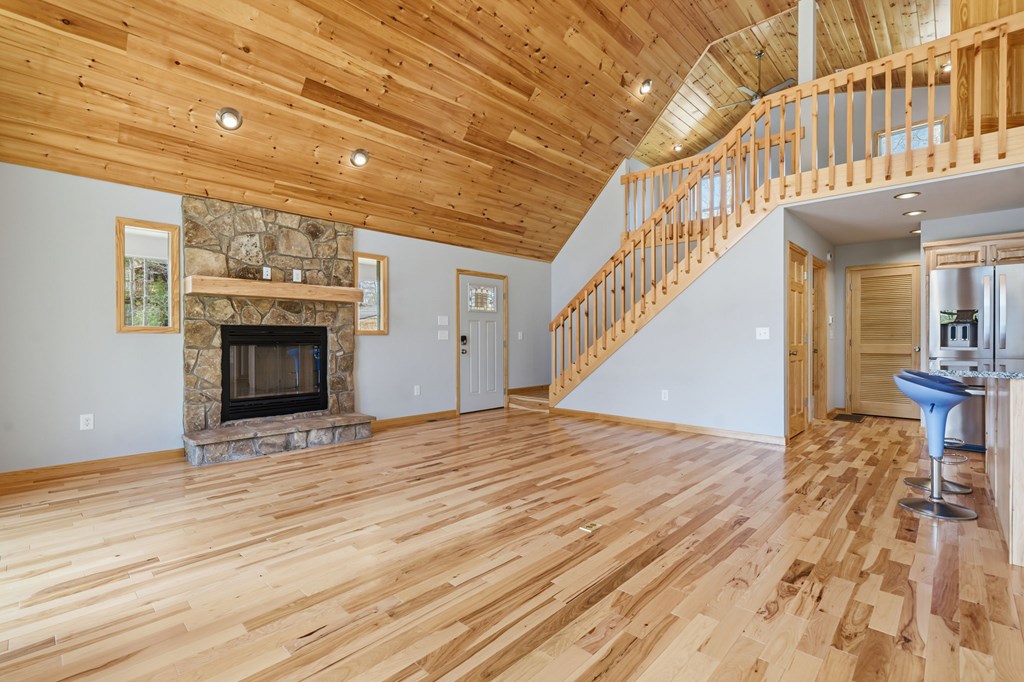 55 Heidis Run Murphy, NC 28906 - Photo 20 of 53 a view of an empty room with wooden floor and a fireplace