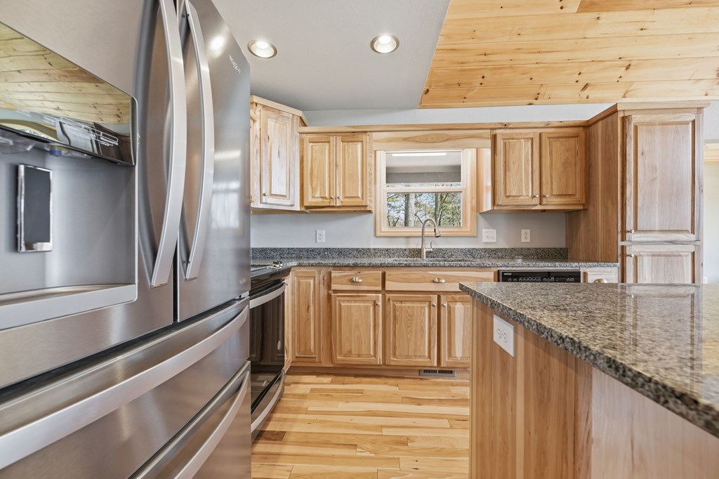 55 Heidis Run Murphy, NC 28906 - Photo 22 of 53 a kitchen with granite countertop a sink stainless steel appliances and cabinets