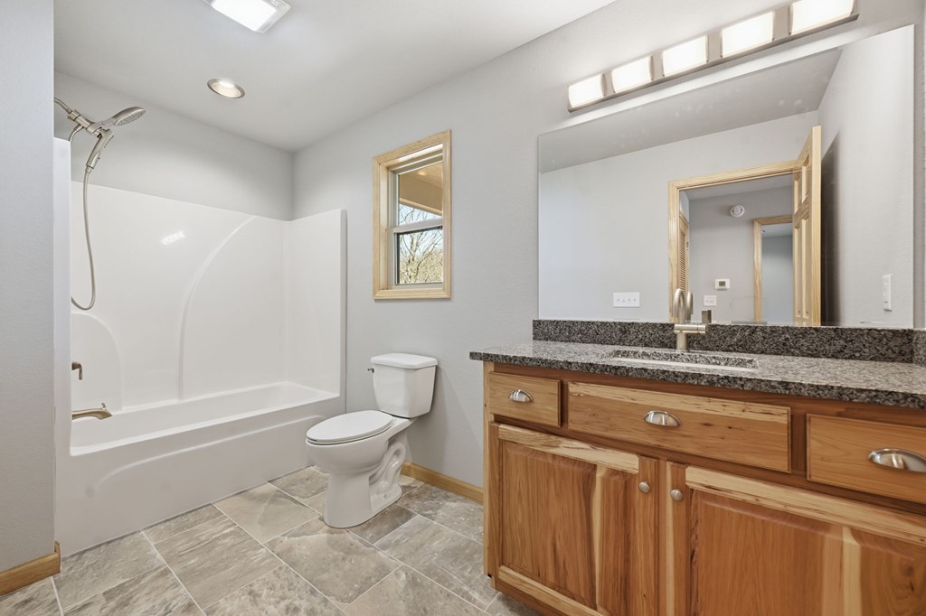55 Heidis Run Murphy, NC 28906 - Photo 29 of 53 a bathroom with a granite countertop sink toilet and shower