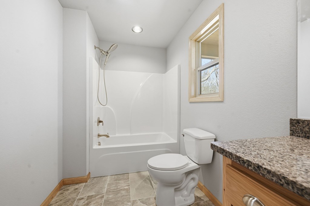 55 Heidis Run Murphy, NC 28906 - Photo 30 of 53 a bathroom with a granite countertop toilet sink and shower