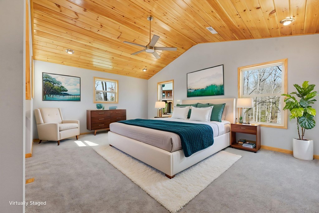 55 Heidis Run Murphy, NC 28906 - Photo 32 of 53 a bedroom with a large bed and a potted plant