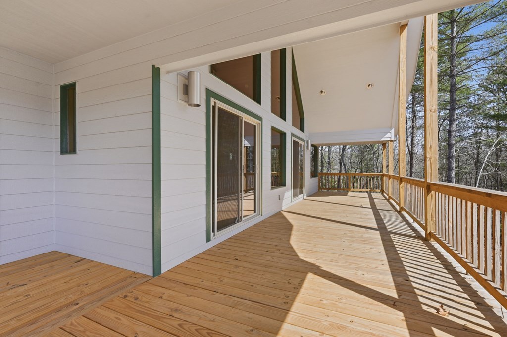 55 Heidis Run Murphy, NC 28906 - Photo 9 of 53 a view of balcony with wooden floor and floor to ceiling window