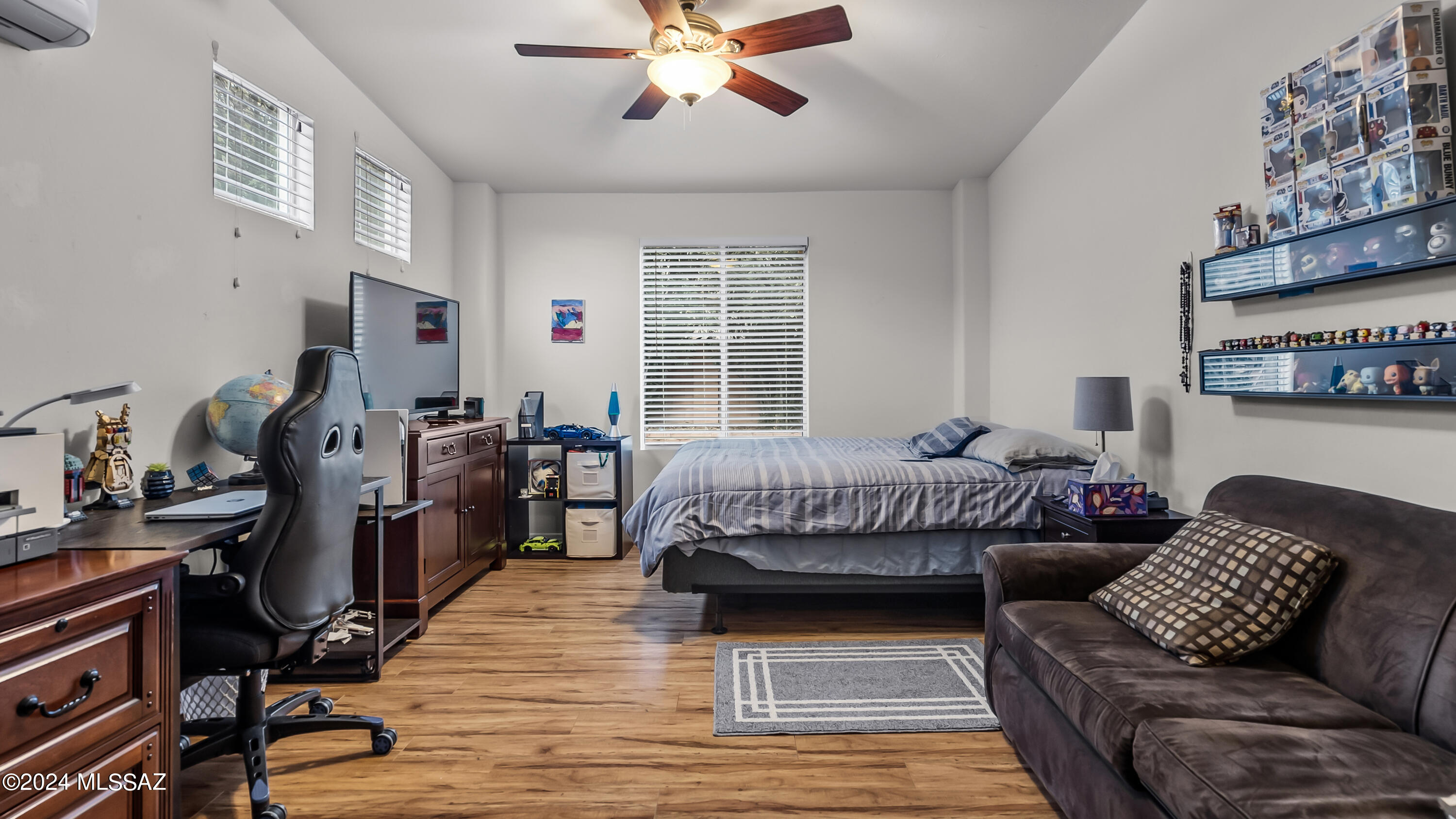 374 Via Capri Rio Rico, AZ 85648 - Photo 21 of 30 a bedroom with furniture and a wooden floor