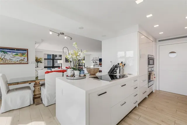 a view of living room and washer and a view of living room