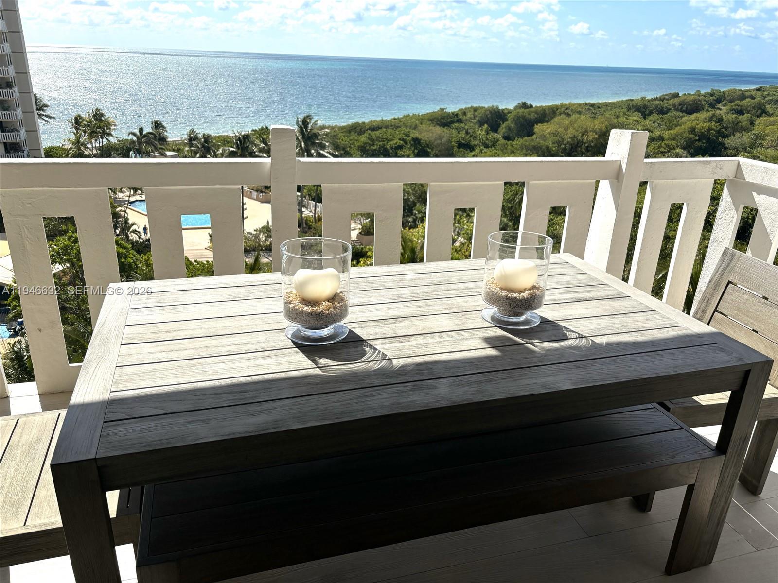 1121 Crandon Boulevard, Unit F802 Key Biscayne, FL 33149 - Photo 13 of 36 a view of table and chair