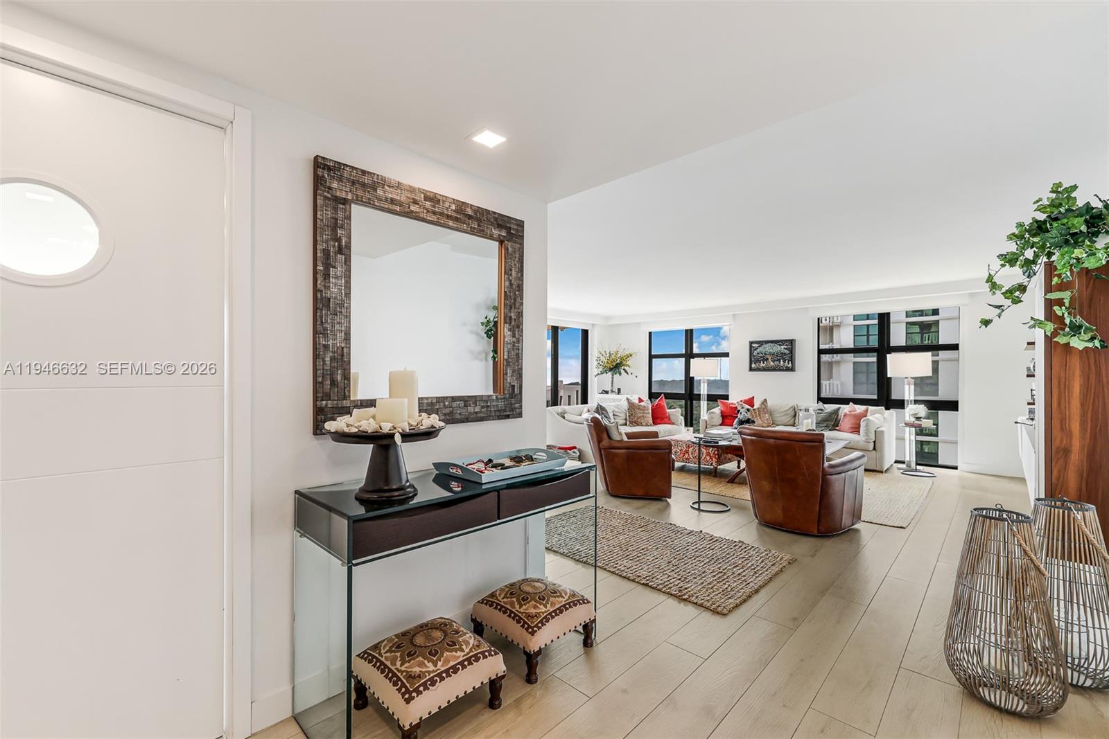 1121 Crandon Boulevard, Unit F802 Key Biscayne, FL 33149 - Photo 2 of 36 a living room with furniture and a window