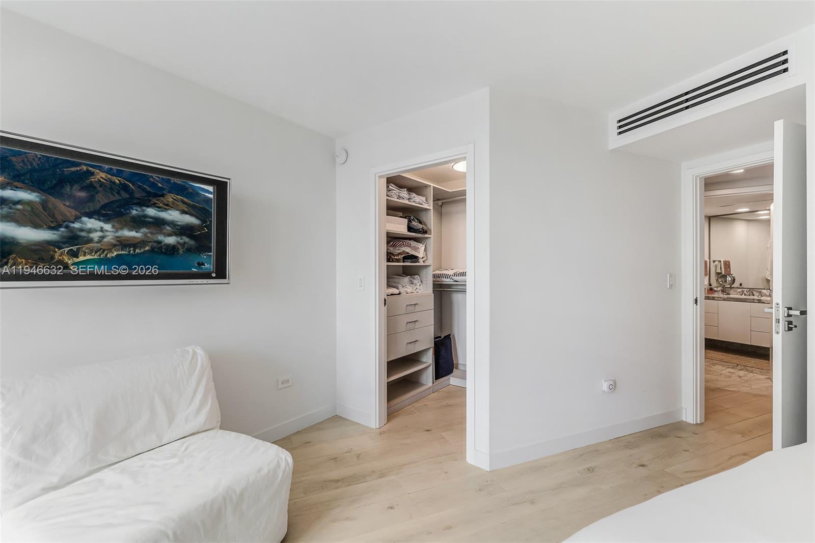 1121 Crandon Boulevard, Unit F802 Key Biscayne, FL 33149 - Photo 23 of 36 a hallway with closet and a potted plant