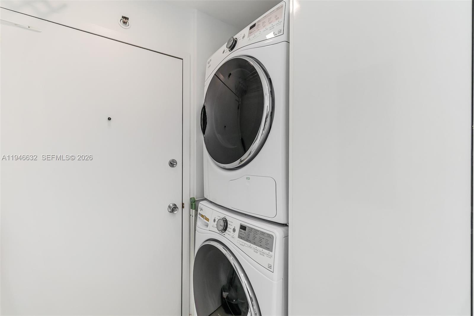 1121 Crandon Boulevard, Unit F802 Key Biscayne, FL 33149 - Photo 25 of 36 a utility room with dryer and washer
