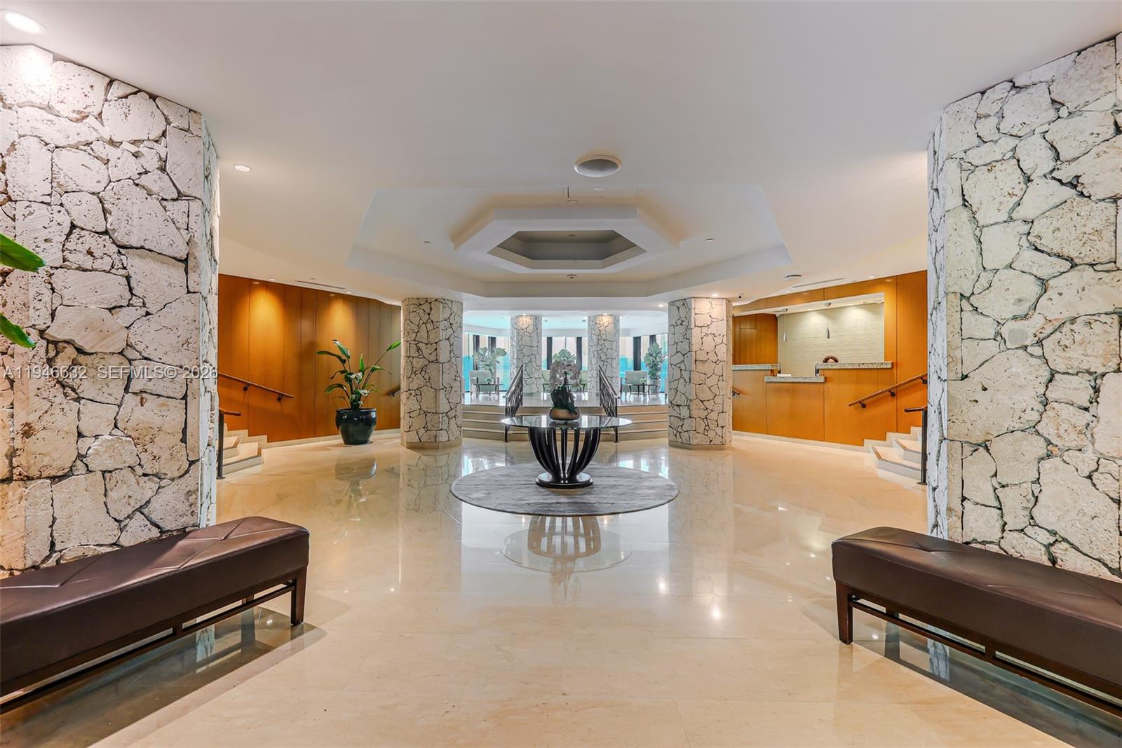 1121 Crandon Boulevard, Unit F802 Key Biscayne, FL 33149 - Photo 30 of 36 a living room with fireplace furniture and a flat screen tv