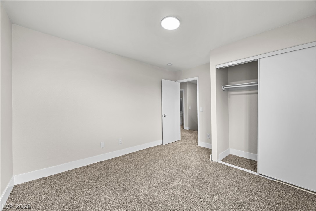 2650 Whisper Ridge Street Las Vegas, NV 89156 - Photo 21 of 28 Soft carpeting underfoot defines this inviting bedroom space complete with a sliding closet.