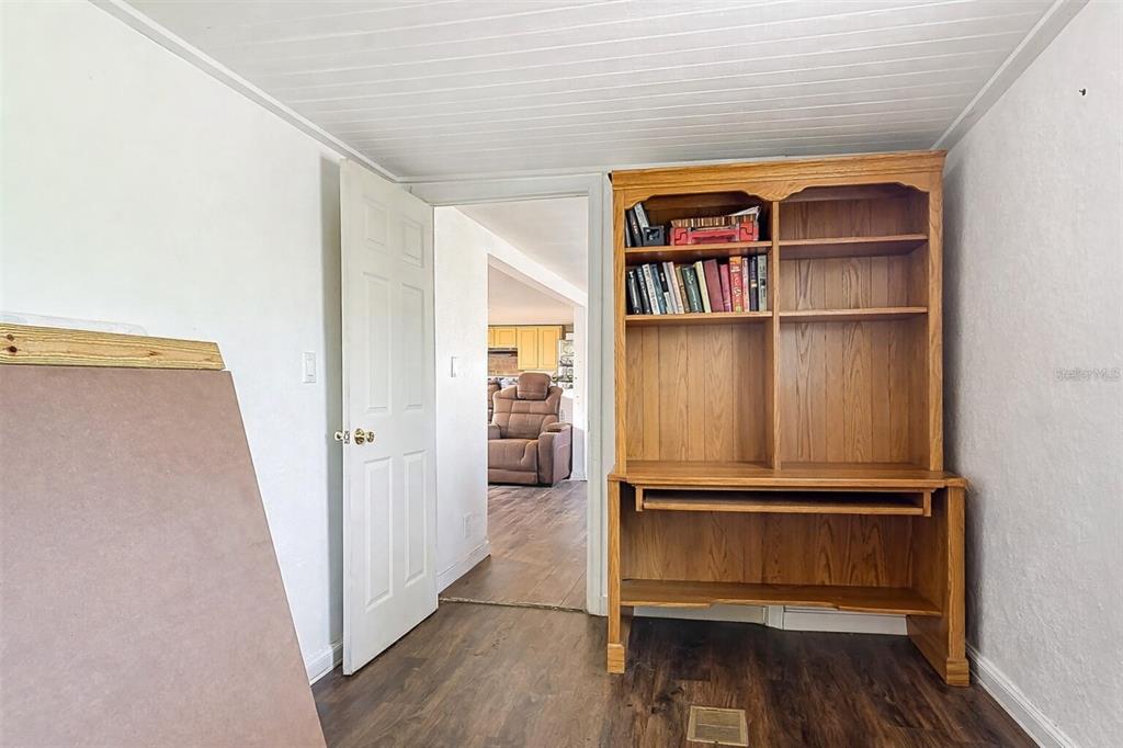 43430 Cooter Pond Road DeLand, FL 32720 - Photo 16 of 37 a view of walk in closet with empty racks