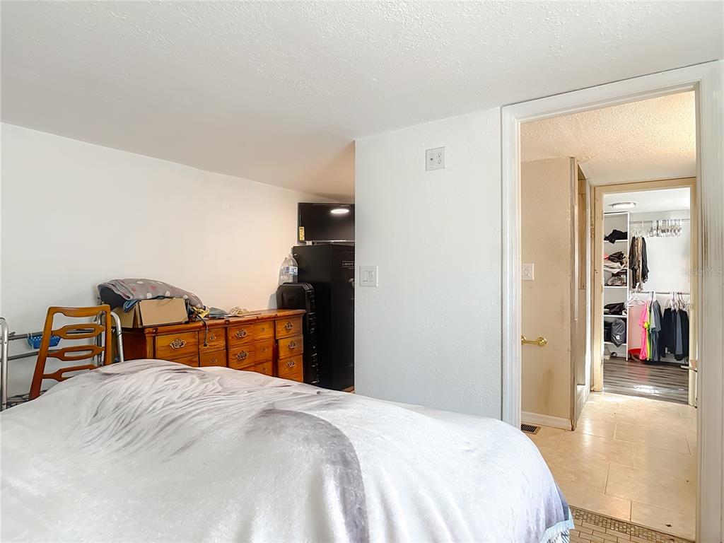 43430 Cooter Pond Road DeLand, FL 32720 - Photo 7 of 37 a bedroom with a bed and a closet