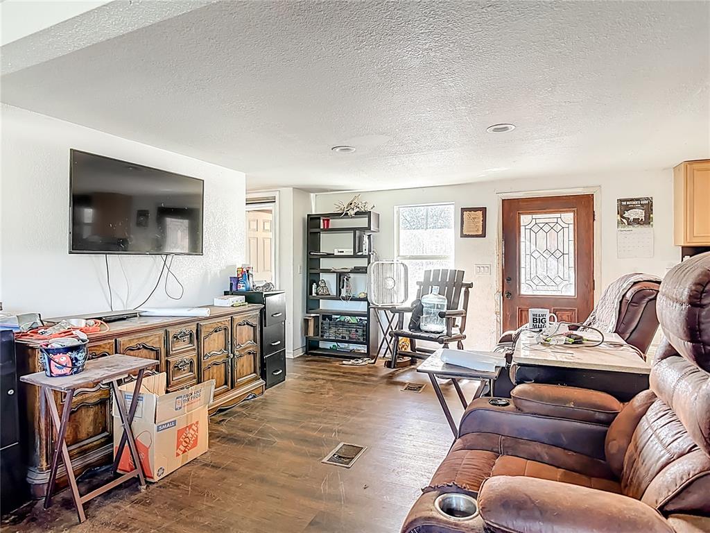 43430 Cooter Pond Road DeLand, FL 32720 - Photo 8 of 37 a living room with furniture a flat screen tv and a window