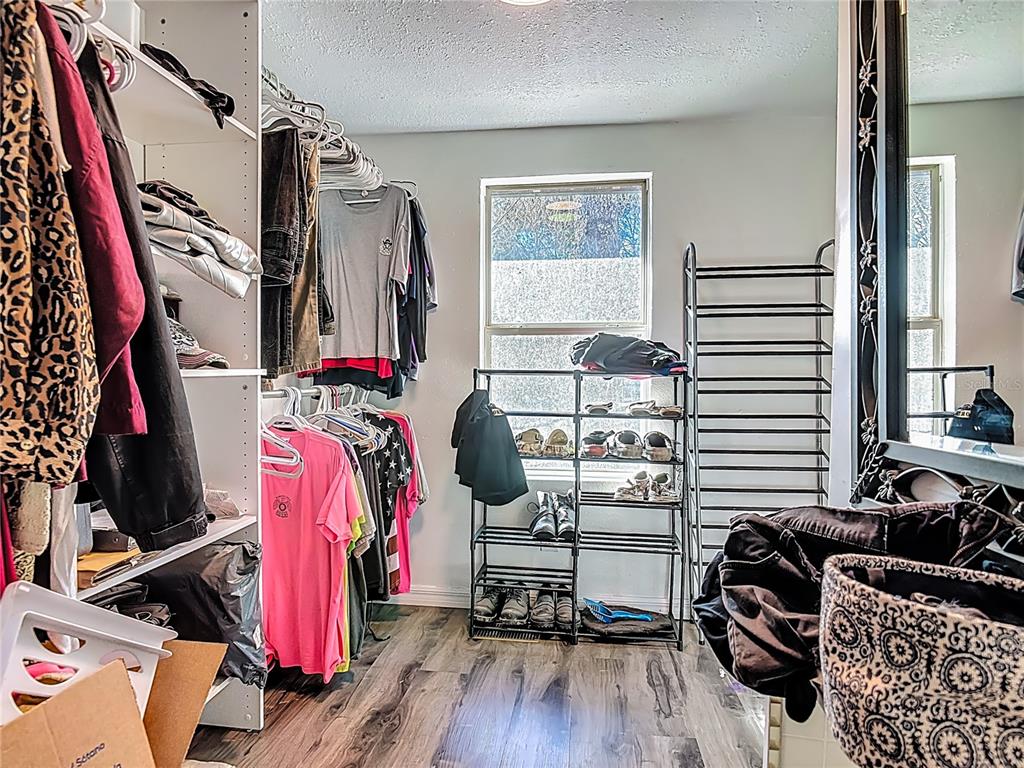 43430 Cooter Pond Road DeLand, FL 32720 - Photo 10 of 37 a view of walk in closet with clothes and shoes