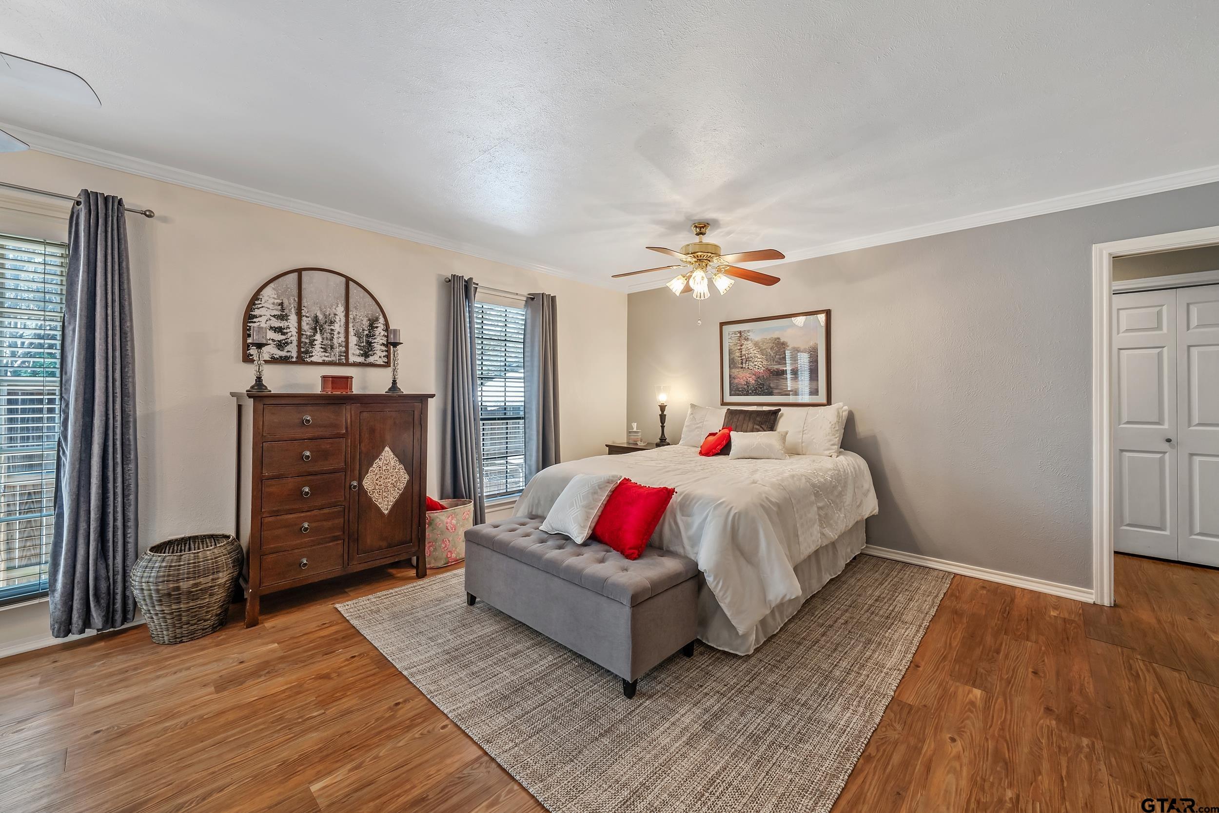 3309 Trafalgar Square Tyler, TX 75701 - Photo 13 of 23 a spacious bedroom with a bed and a dresser