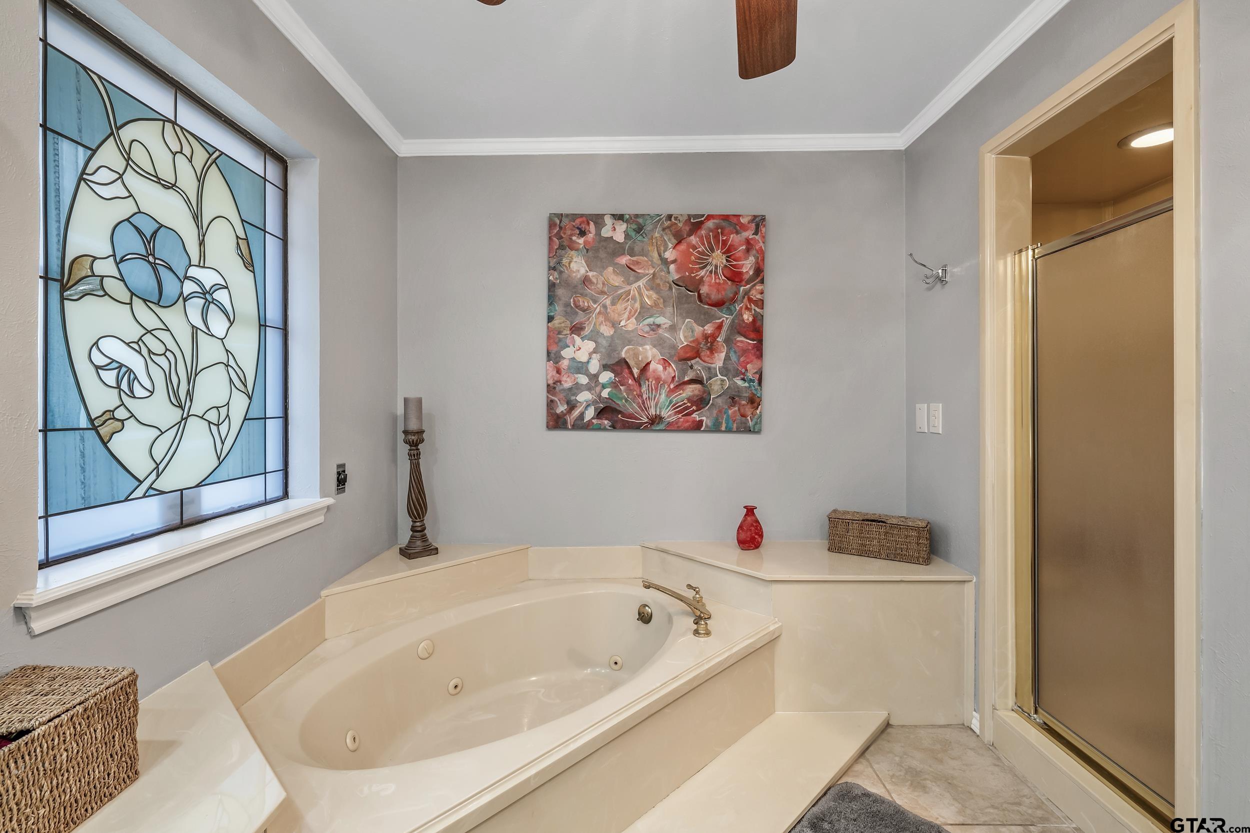 3309 Trafalgar Square Tyler, TX 75701 - Photo 16 of 23 a bathroom with a tub and sink