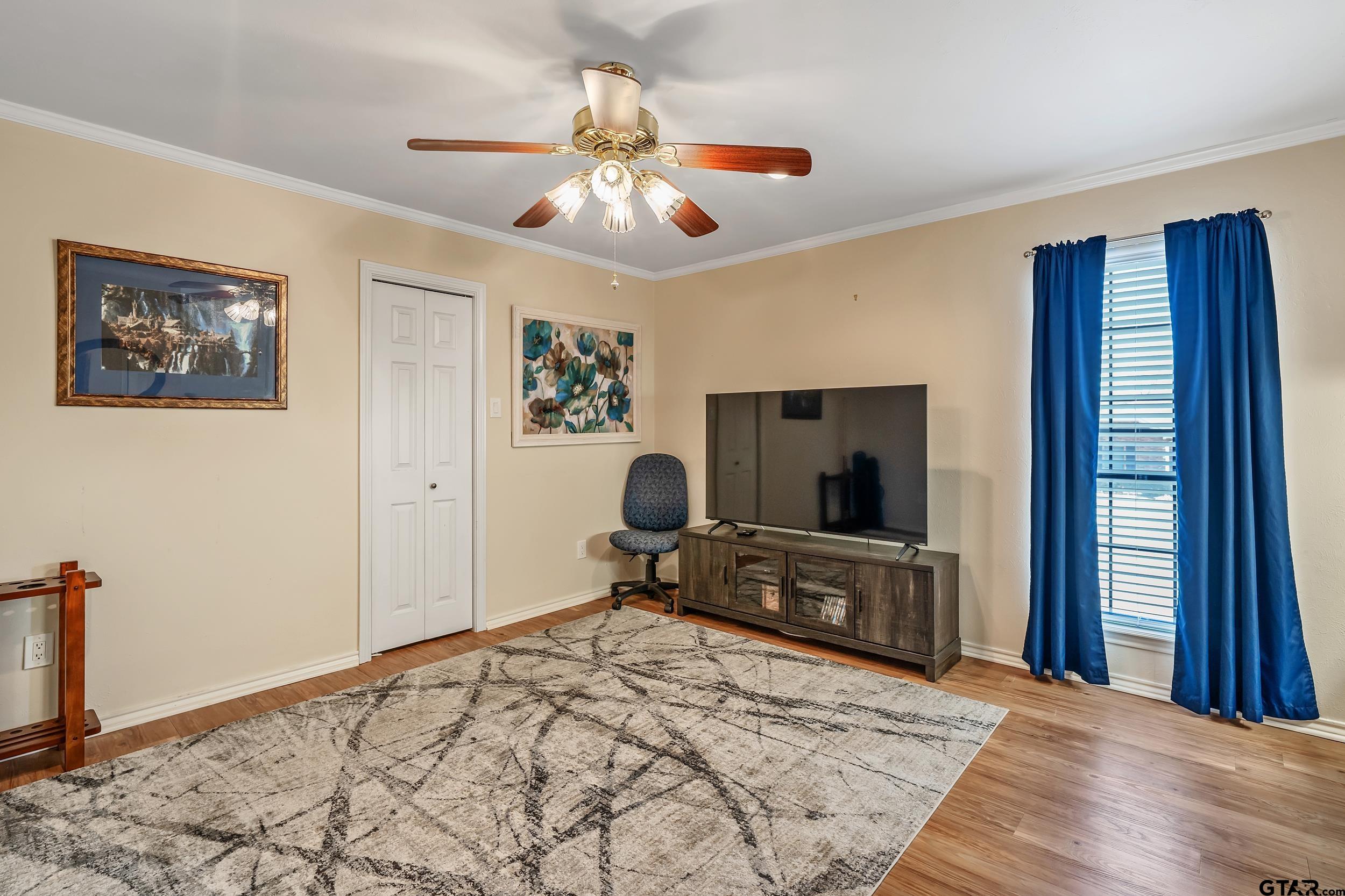 3309 Trafalgar Square Tyler, TX 75701 - Photo 17 of 23 a bedroom with a bed and a flat screen tv