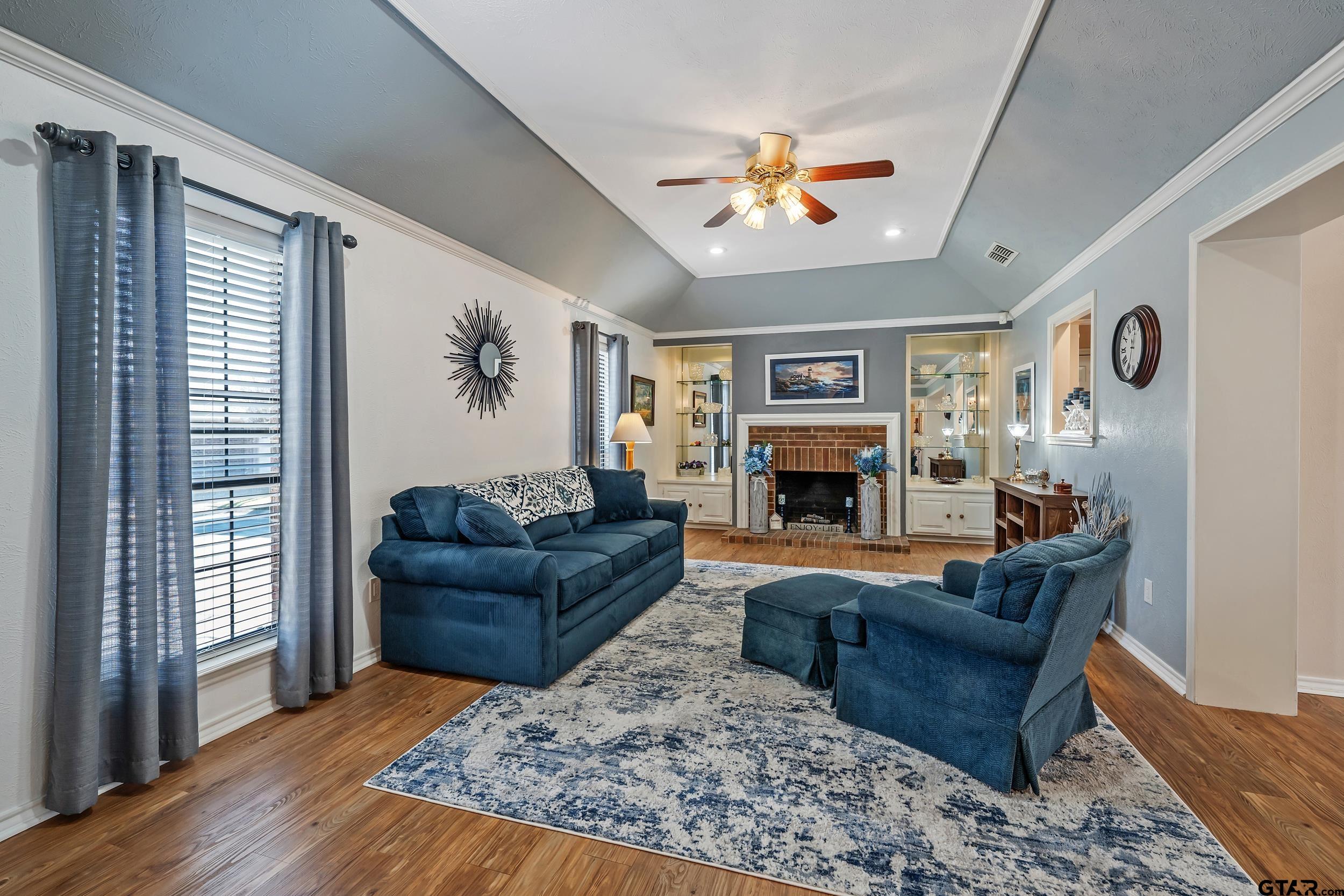 3309 Trafalgar Square Tyler, TX 75701 - Photo 5 of 23 a living room with furniture and a fireplace